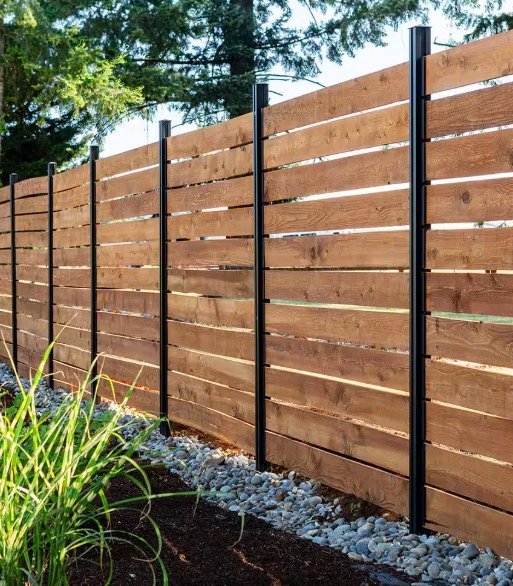 Horizontal wood privacy fence with black metal posts