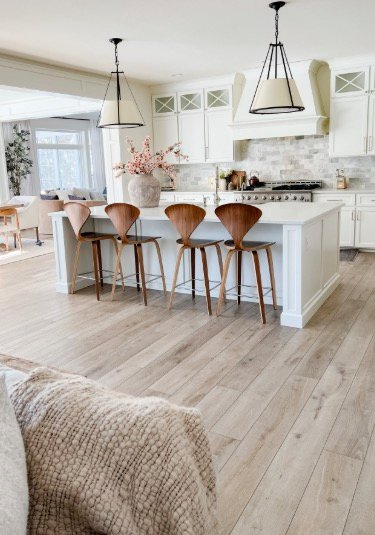 Light luxury vinyl plank flooring in a bright kitchen